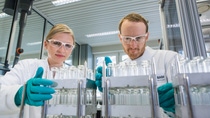 Two employees working for research and development in a BASF Ludwigshafen lab environment.